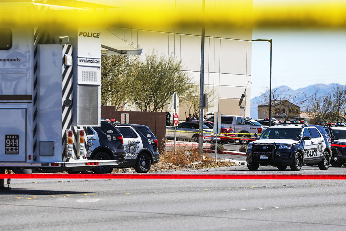 Police investigate the scene of an officer-involved shooting Monday, March 1, 2021 in northeast ...