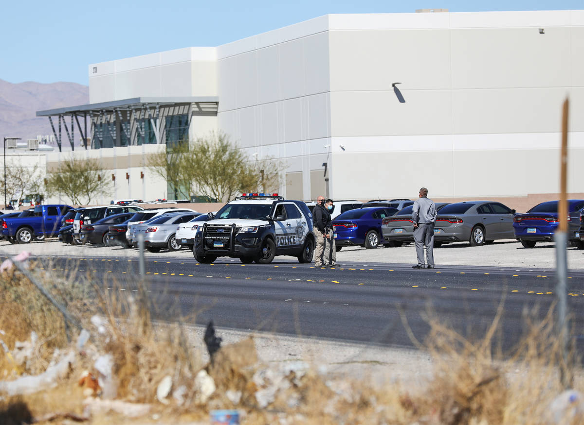 Police investigate the scene of an officer-involved shooting Monday, March 1, 2021 in northeast ...