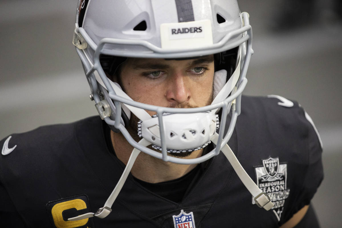 Raiders quarterback Derek Carr (4) waits to take the field before the start of an NFL football ...