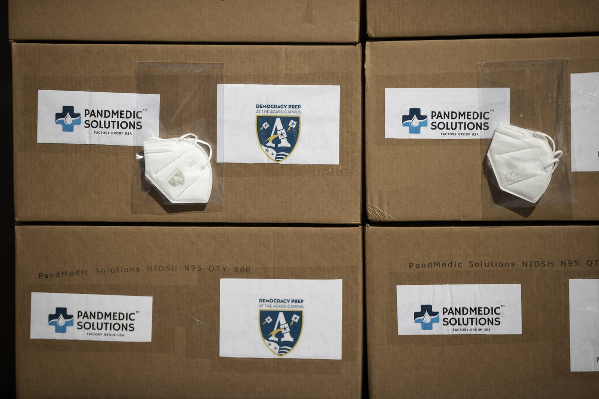 Boxes containing 10,000 N95 masks donated to three local schools are seen at the PandMedic Solu ...