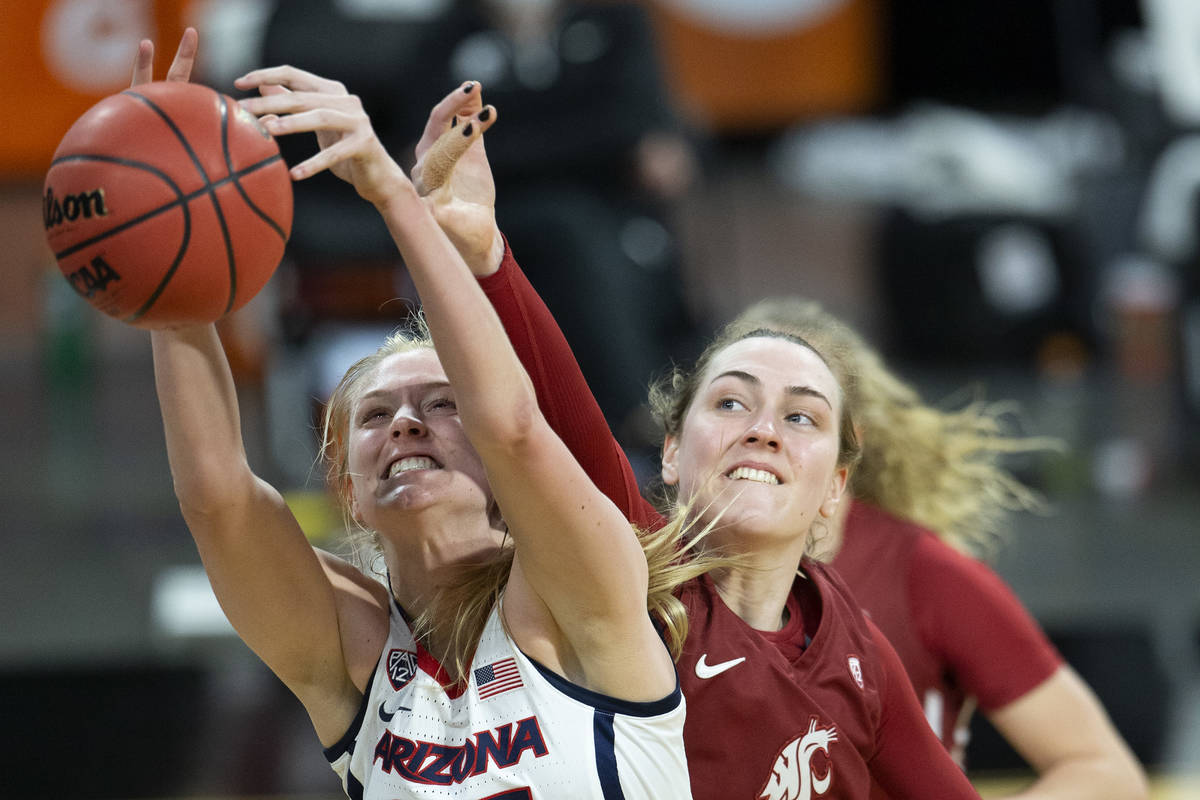 Arizona Wildcats forward Cate Reese (25) attempts a point as Washington State Cougars center Em ...
