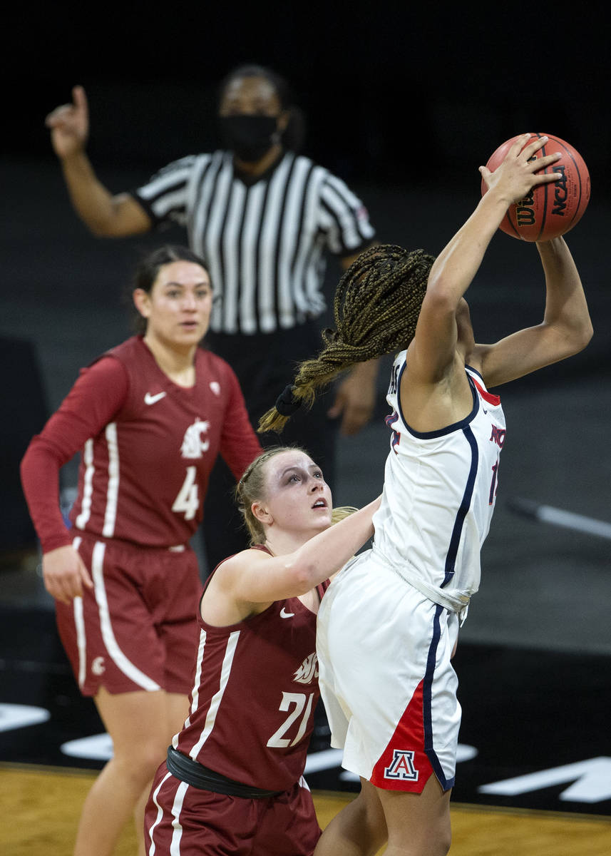 Arizona Wildcats forward Sam Thomas (14) gains possession of the ball from the Washington State ...