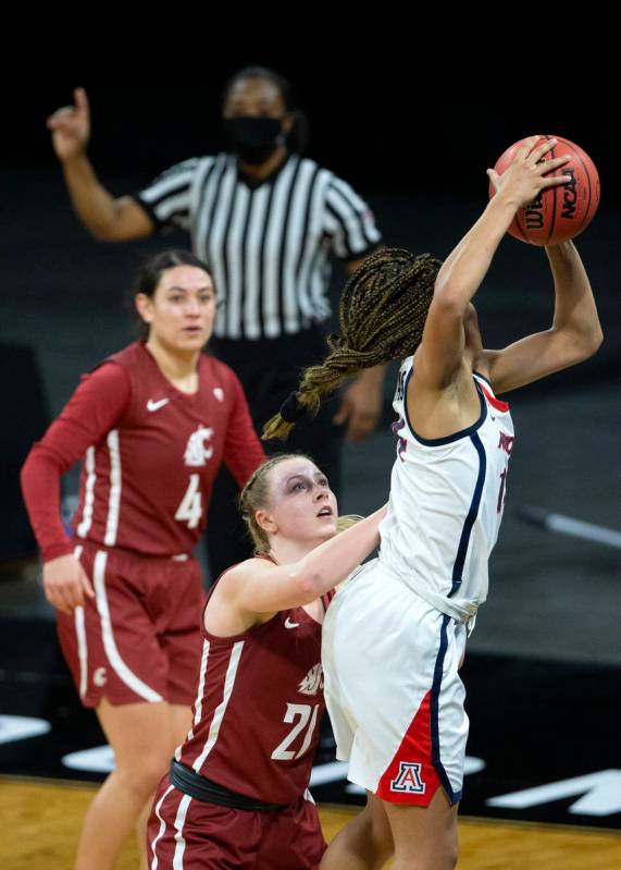 Arizona Wildcats forward Sam Thomas (14) gains possession of the ball from the Washington State ...