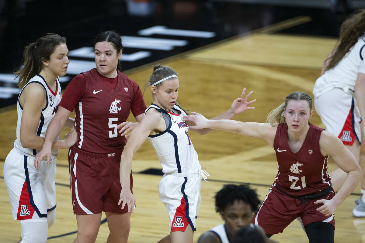 Washington State Cougars guard Charlisse Leger-Walker (5) guards Arizona Wildcats guard Helena ...