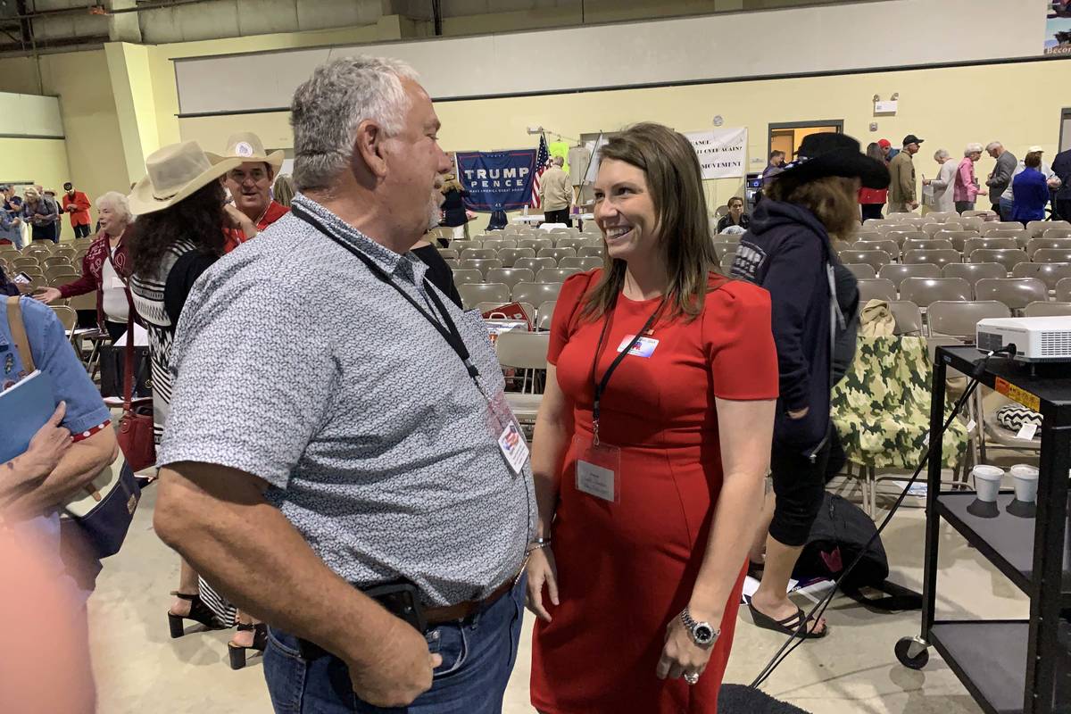 Mesquite City Councilwoman Annie Black speaks to a party delegate at the state party central co ...