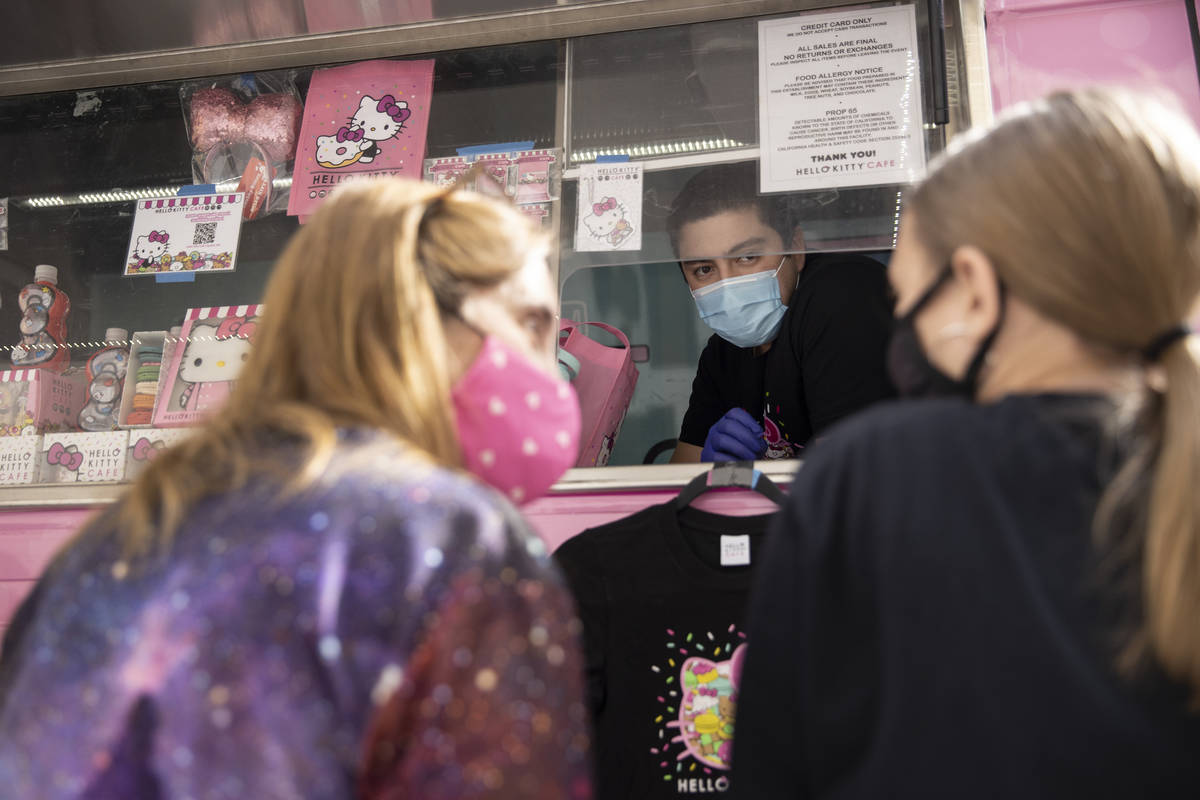 Joe Gonzales, center, assists Kara Ness, left, and her daughter Ella Ness-Pavlinsky, 13, with t ...