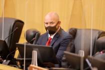 Detective Michael Condratovich watches video while testifying during a fact-finding review at t ...