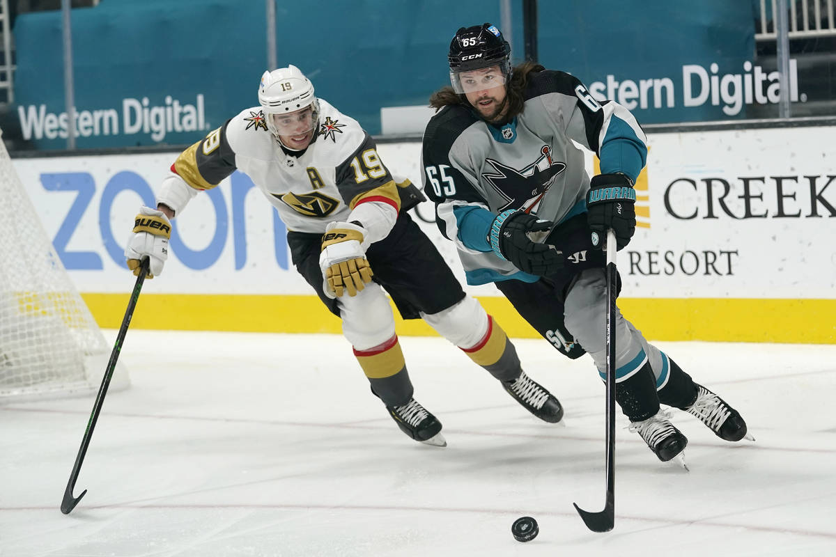 San Jose Sharks defenseman Erik Karlsson, right, skates in front of Vegas Golden Knights right ...