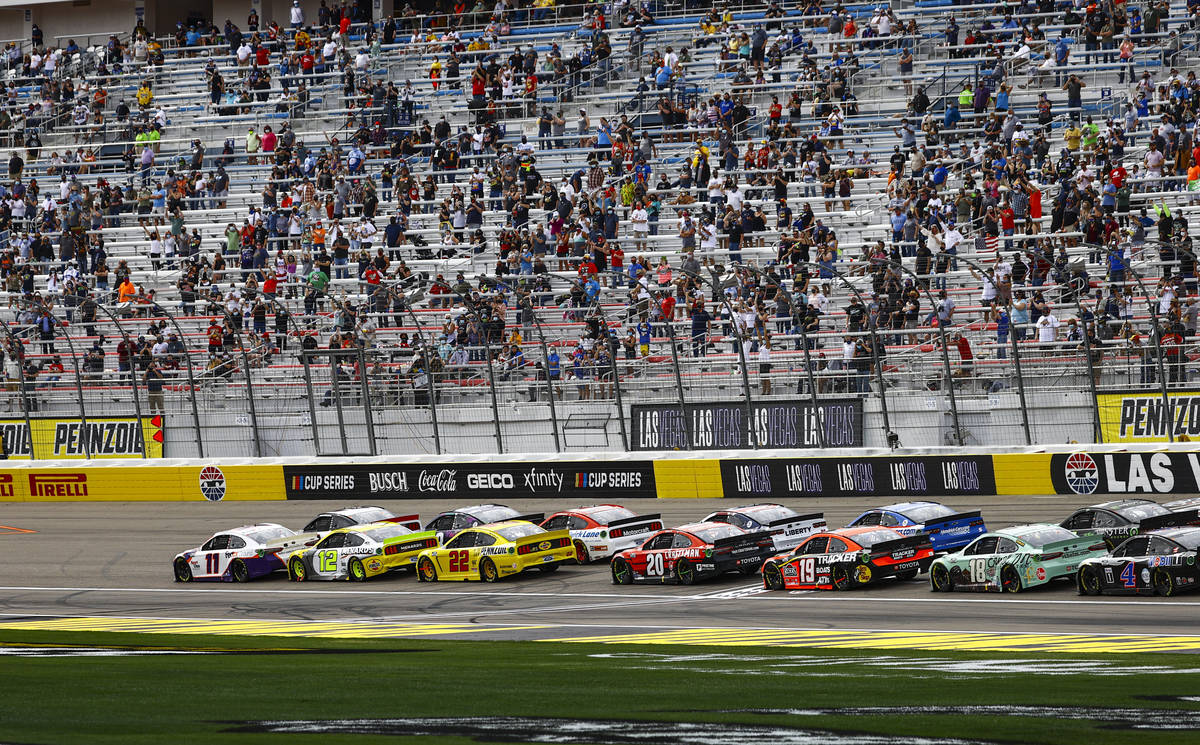 Drivers restart during the NASCAR Cup Series Pennzoil 400 auto race at the Las Vegas Motor Spee ...