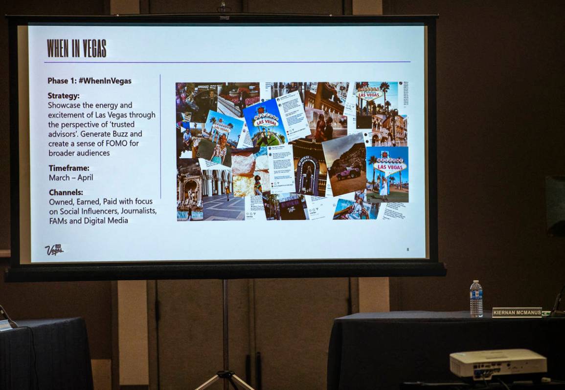 An information slide is seen on the screen as Kate Wik, chief marketing officer for the Las Veg ...