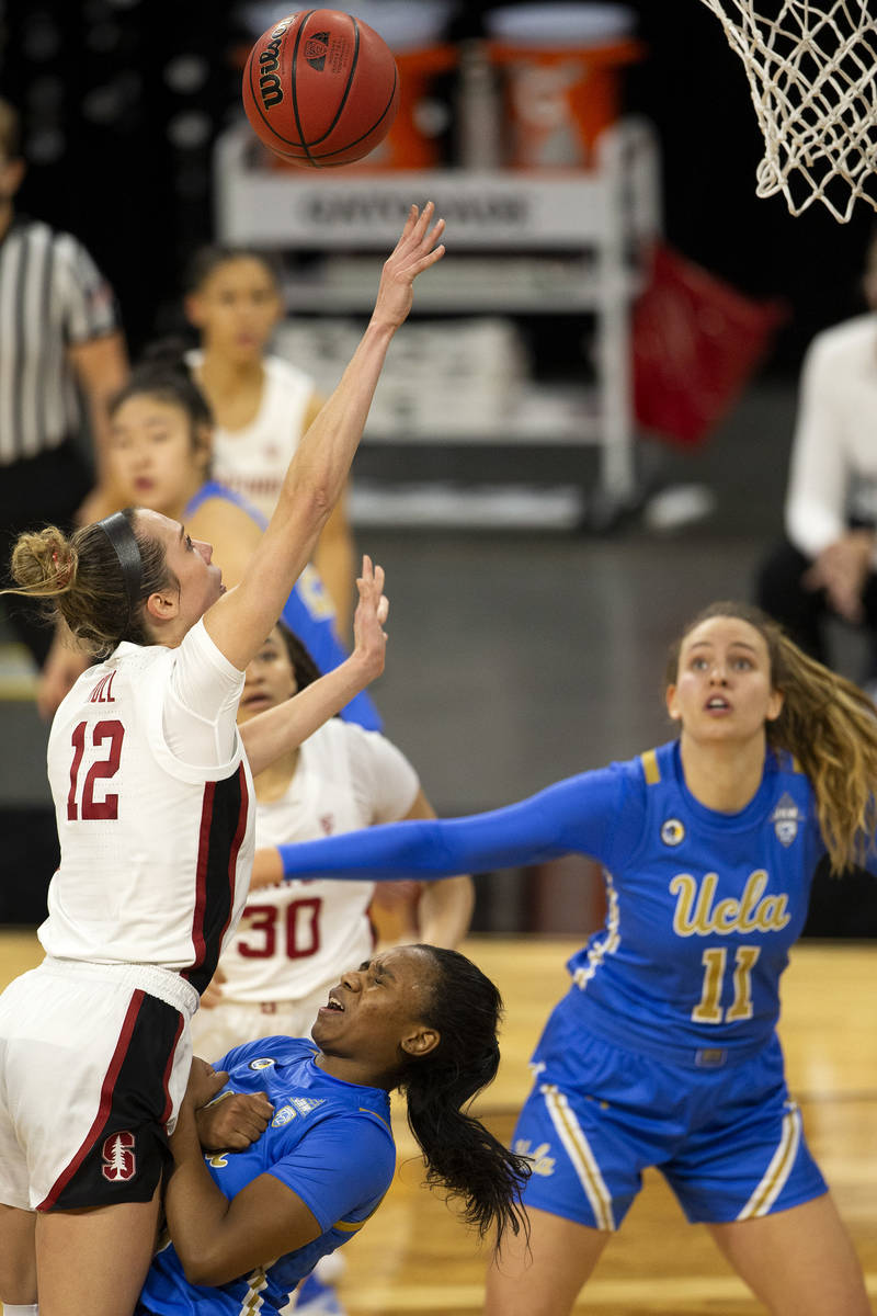 Stanford Cardinal guard Lexie Hull (12) shoots a point as UCLA Bruins forward Michaela Onyenwer ...