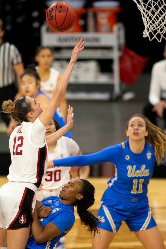 Stanford Cardinal guard Lexie Hull (12) shoots a point as UCLA Bruins forward Michaela Onyenwer ...