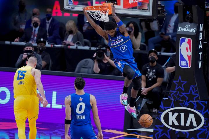 Brooklyn Nets guard Kyrie Irving dunks during the second half of basketball's NBA All-Star Game ...
