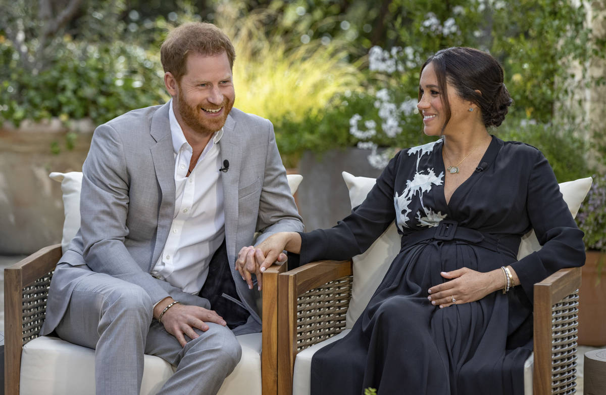 This image provided by Harpo Productions shows Prince Harry, left, and Meghan, Duchess of Susse ...