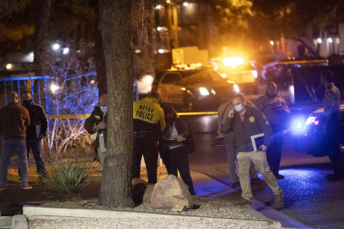 Las Vegas police investigate the scene of a homicide at the 3600 block of Paradise Road in Las ...