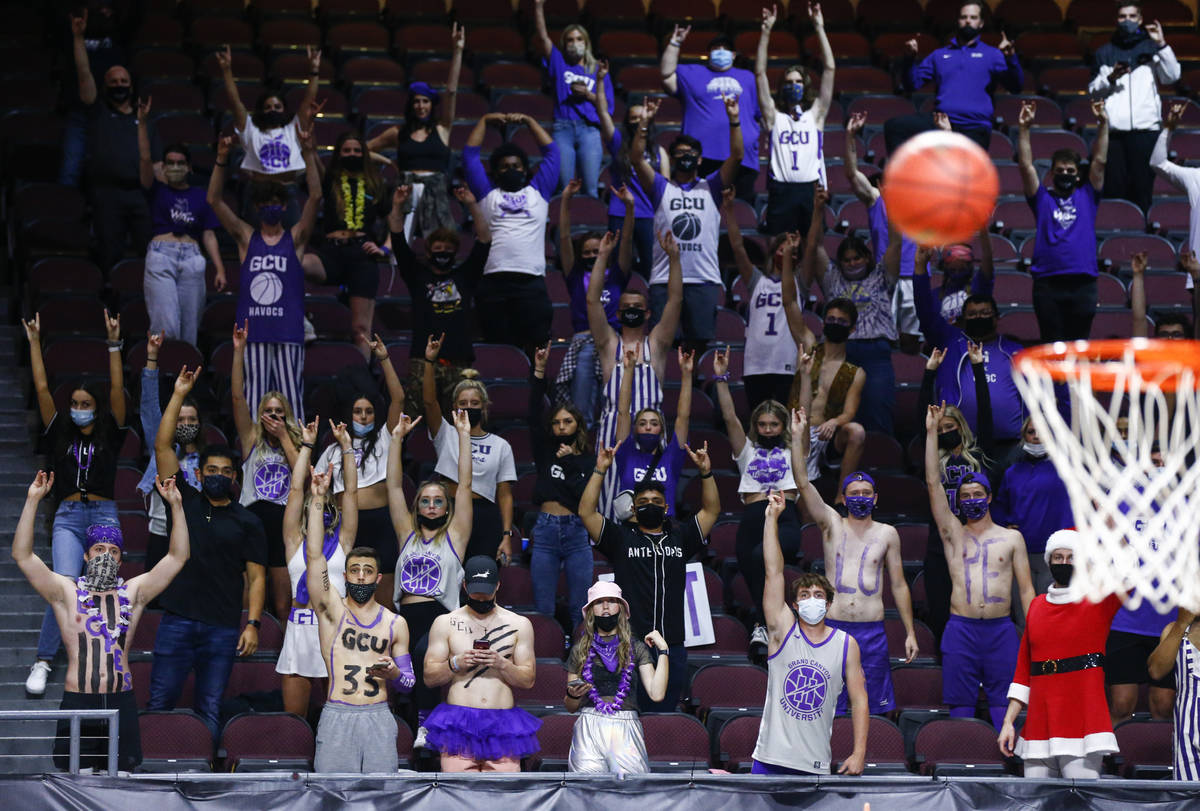 Grand Canyon fans raise their hands during a free throw attempt in the second half of the team' ...