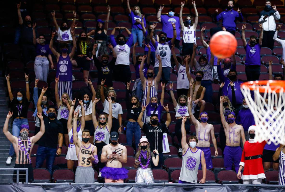 Grand Canyon fans raise their hands during a free throw attempt in the second half of the team' ...