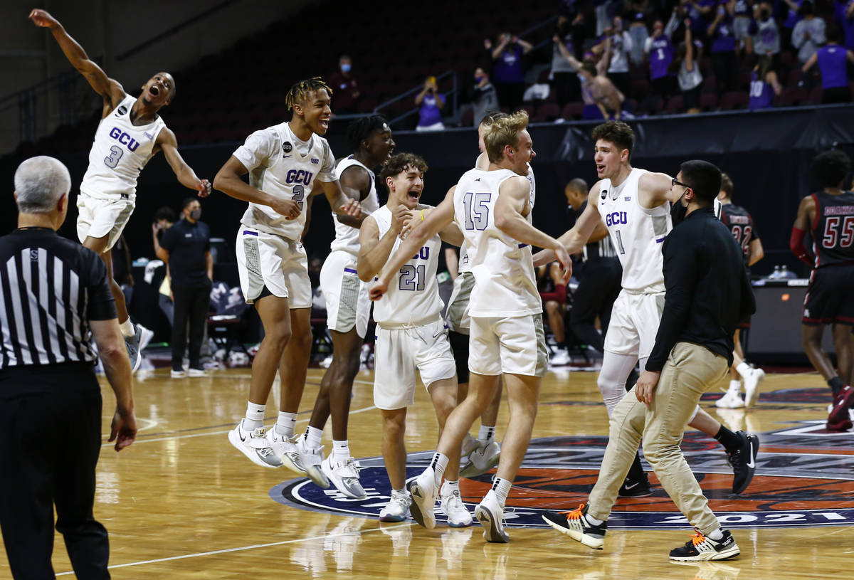 Grand Canyon players celebrate after defeating New Mexico State 74-56 in an NCAA college basket ...