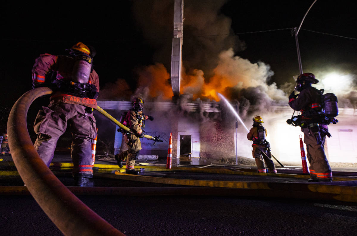 Las Vegas firefighters battle flames engulfing a vacant wedding chapel at 1431 S. Las Vegas Blv ...