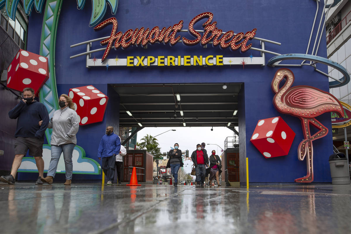 Visitors to downtown enter Fremont Street Experience on Saturday, Feb. 13, 2021, in Las Vegas. ...