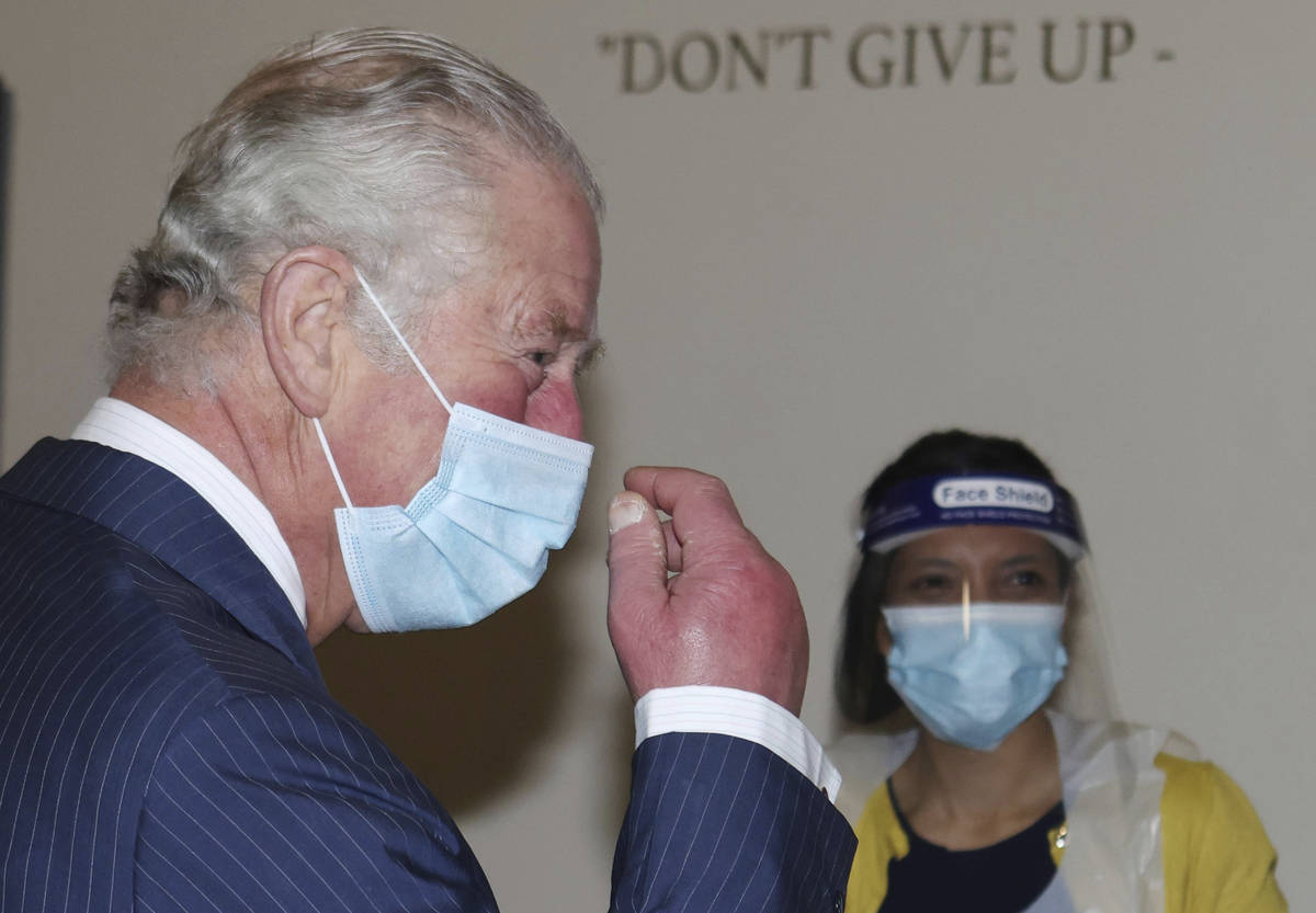 Britain's Prince Charles during a visit to an NHS vaccine pop-up clinic at Jesus House church, ...