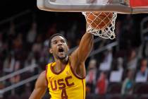 In this Feb. 17, 2021, file photo, Southern California forward Evan Mobley dunks during the sec ...