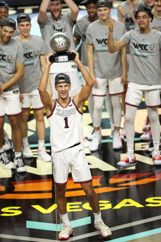 Gonzaga Bulldogs guard Jalen Suggs (1) is awards the tournament's most valuable player trophy ...