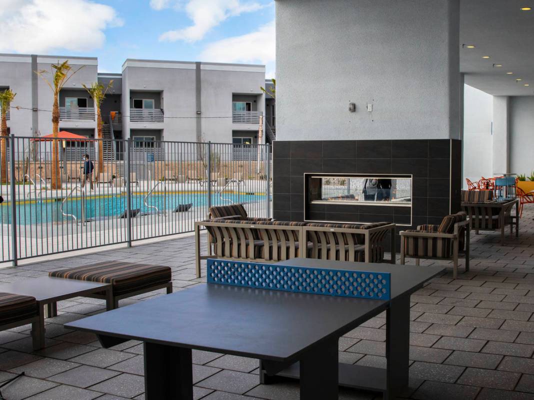Outdoor fireplace and play area at the newly opened Showboat Park apartment complex, on Wednesd ...
