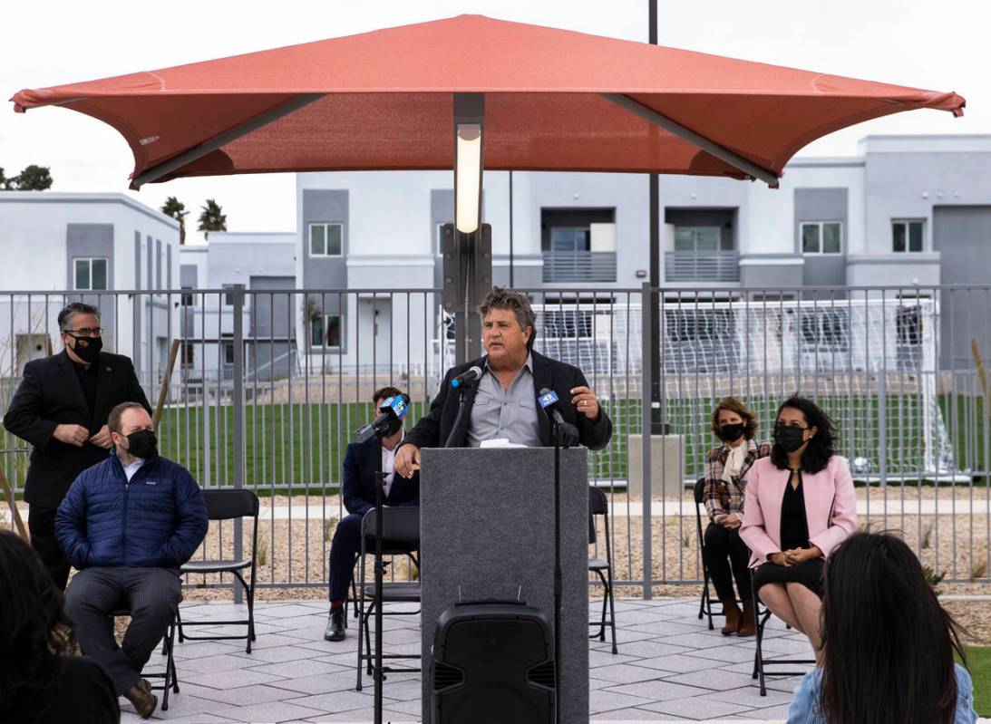 Chi Chi Bengochea, developer of the Showboat Park apartment complex, speaks prior to a ribbon-c ...