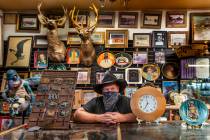 Owner Bryan Smalley behind a counter of the Hidden Treasure Trading Co. just into Goldfield alo ...
