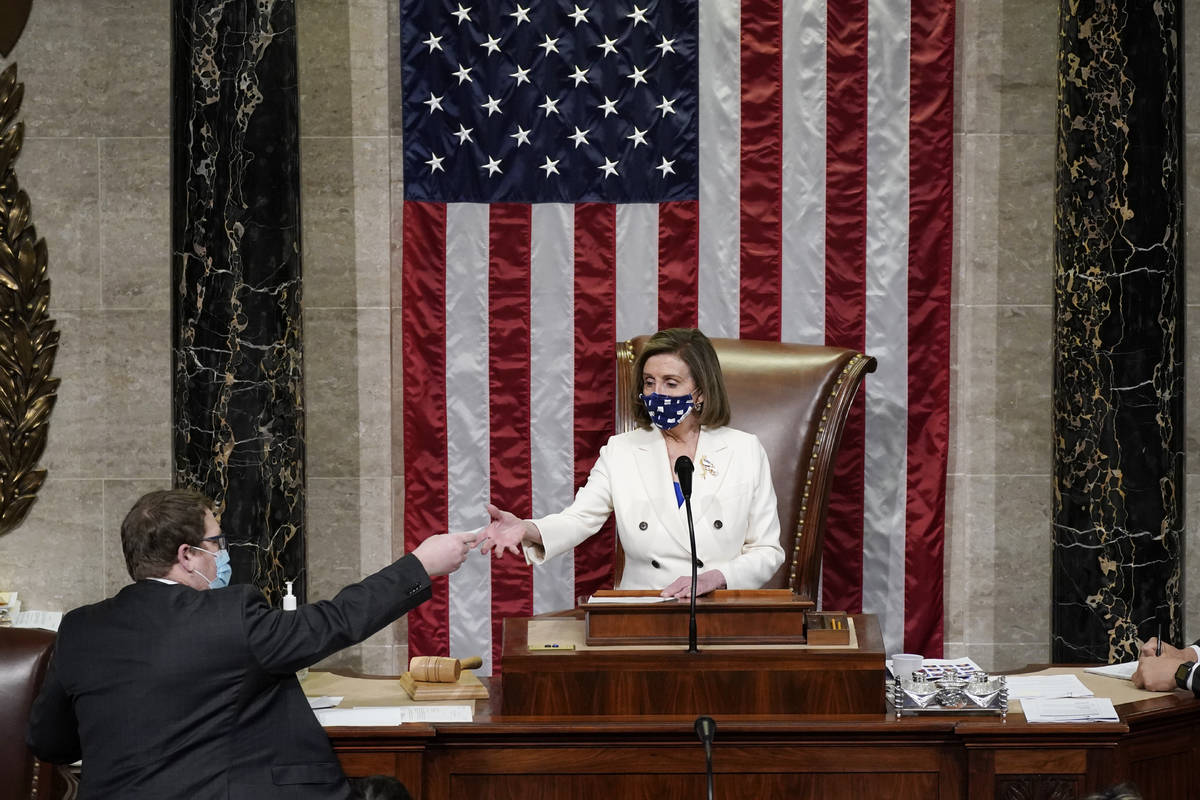 Speaker of the House Nancy Pelosi, D-Calif., leads the vote to approve a landmark $1.9 trillion ...