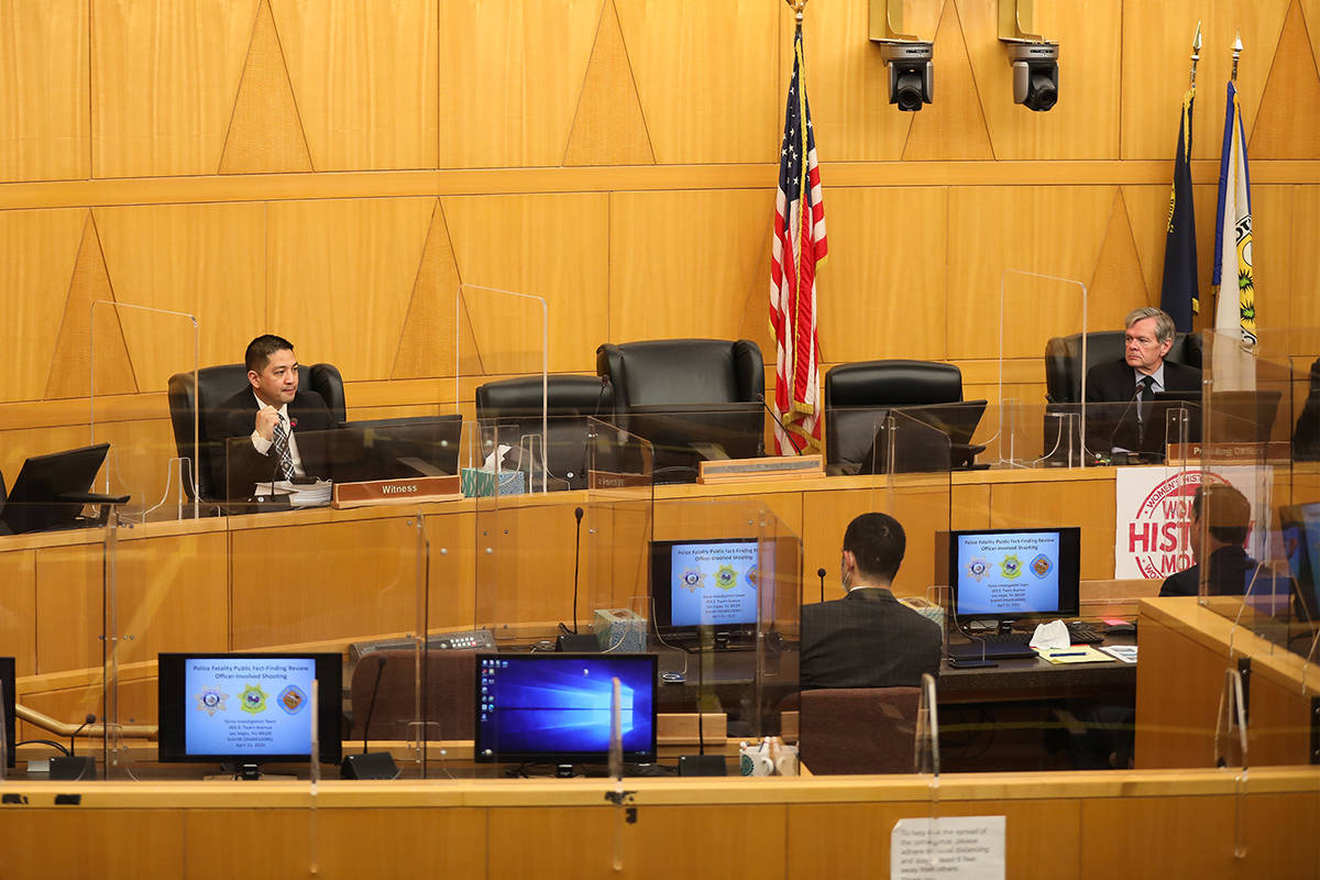 Metropolitan Police Detective Scott Mendoza, left, speaks at a fact find review for the officer ...