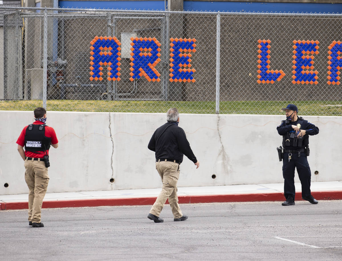 Law enforcement officers investigate a shooting outside of George Harris Elementary School in L ...