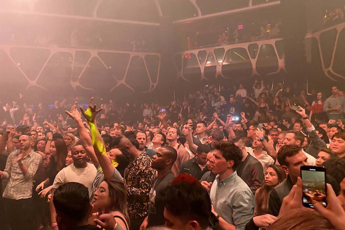 CES conventioneers and clubgoers dance to Tiesto during the DreamlandXR Closing Night Party at ...