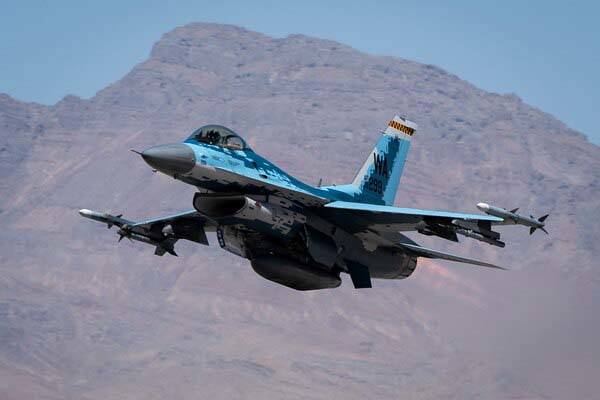 An F-16 Fighting Falcon assigned to the 64th Aggressor Squadron at Nellis Air Force Base, Nevad ...