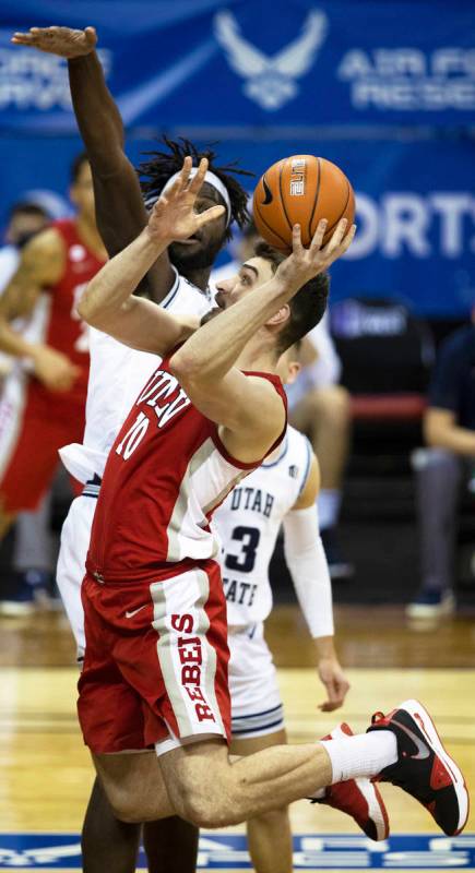 UNLV Rebels forward Edoardo Del Cadia (10) drives past Utah State Aggies center Neemias Queta ( ...