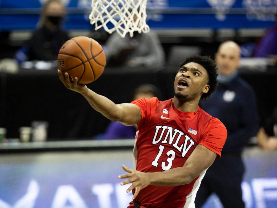 UNLV Rebels guard Bryce Hamilton (13) converts a fast break layup in the first half during the ...