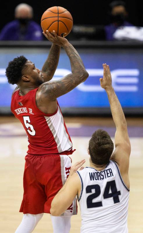 UNLV Rebels guard David Jenkins Jr. (5) shoots over Utah State Aggies guard Rollie Worster (24) ...