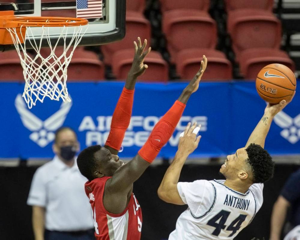 Utah State Aggies guard Marco Anthony (44) shoots over UNLV Rebels forward Cheikh Mbacke Diong ...