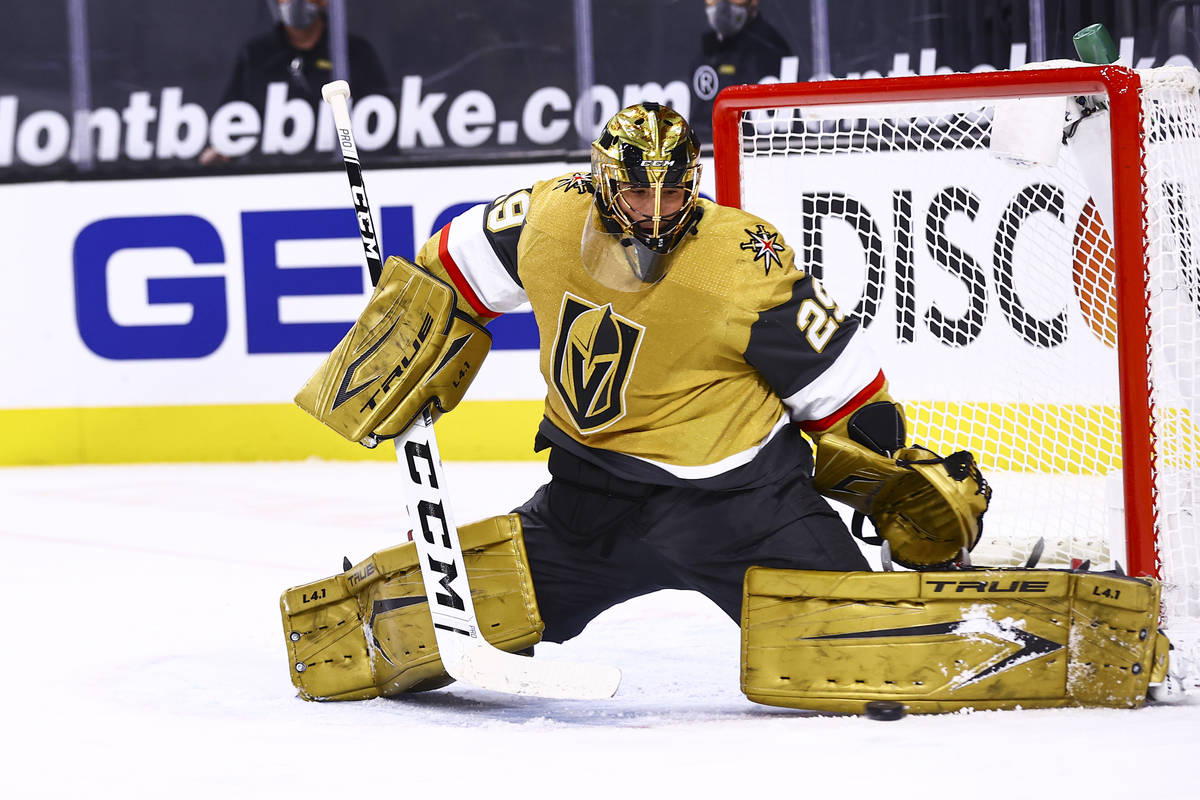 Golden Knights goaltender Marc-Andre Fleury (29) blocks the puck during the first period of an ...