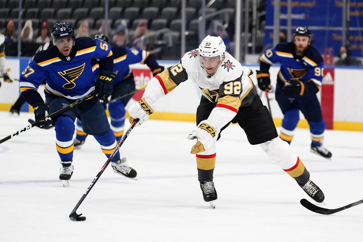 Vegas Golden Knights' Tomas Nosek (92) chases after a loose puck as St. Louis Blues' David Perr ...