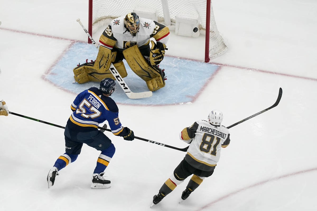 St. Louis Blues' David Perron (57) and Vegas Golden Knights' Jonathan Marchessault (81) watch a ...