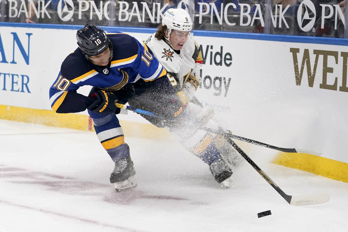 St. Louis Blues' Brayden Schenn (10) and Vegas Golden Knights' Cody Glass (9) chase after a loo ...