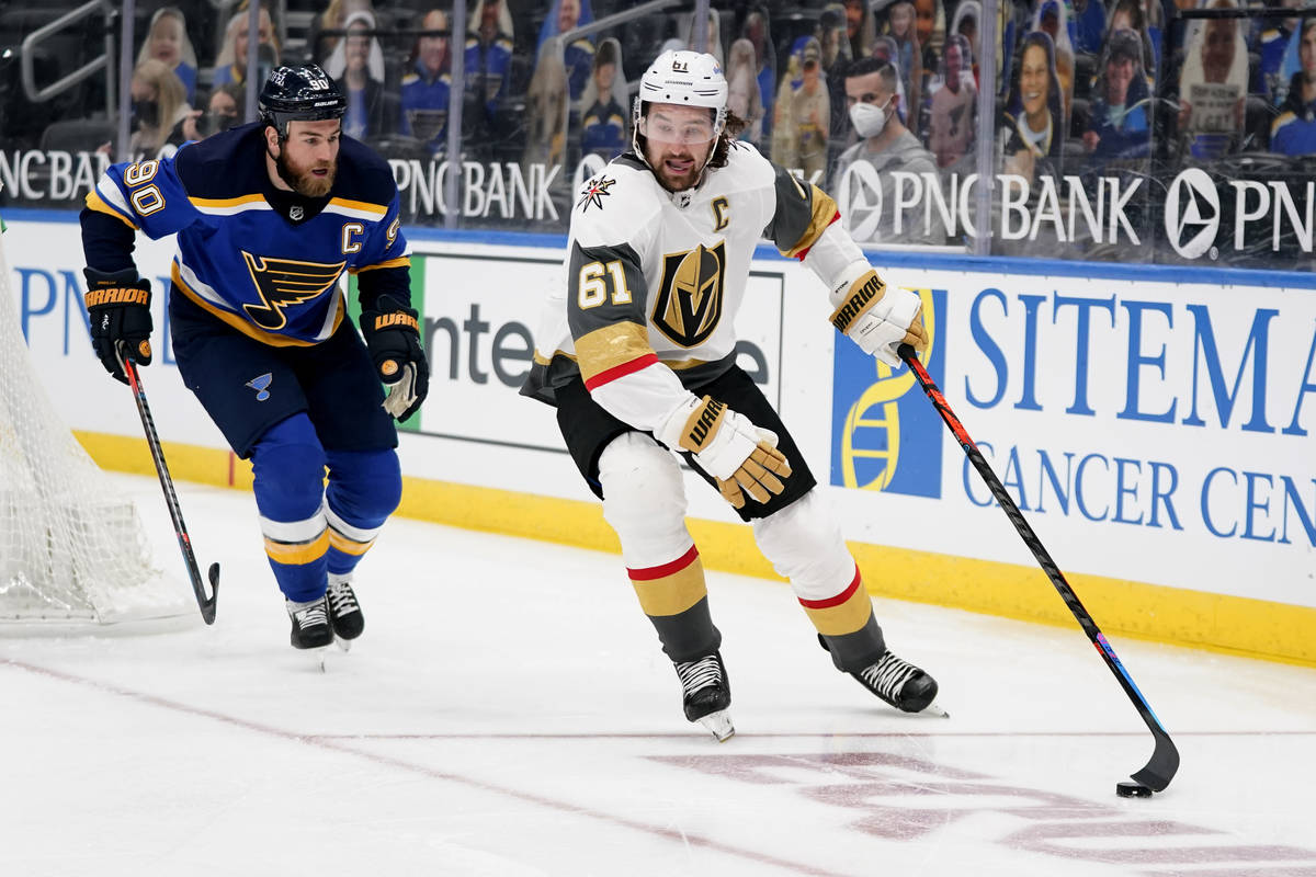 Vegas Golden Knights' Mark Stone (61) handles the puck as St. Louis Blues' Ryan O'Reilly (90) d ...