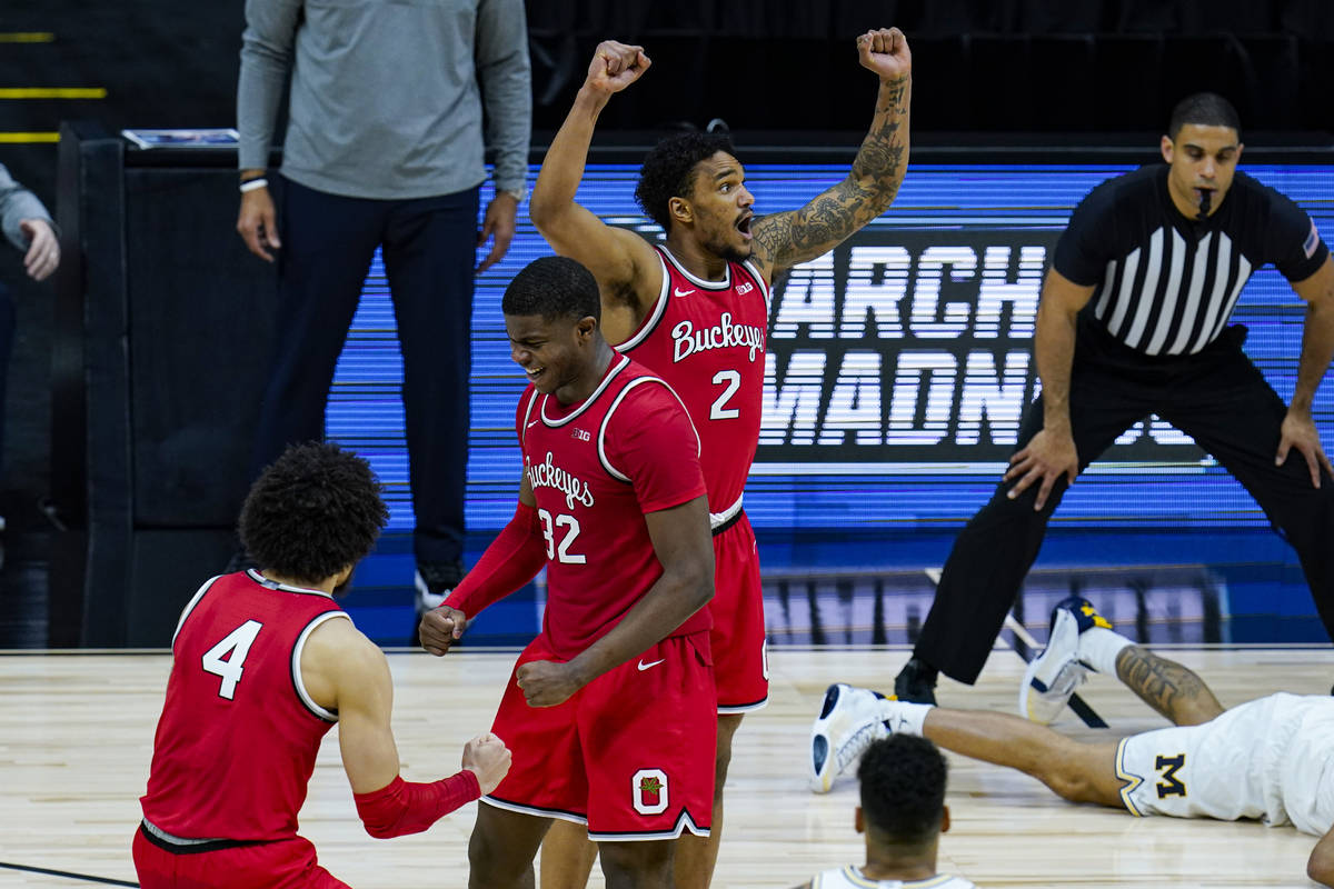 Ohio State's Duane Washington Jr. (4), E.J. Liddell (32) and Musa Jallow (2) celebrate after a ...