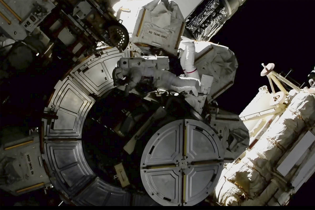 In this image provided by NASA shows NASA astronauts Victor Glover and Mike Hopkins on a spacew ...