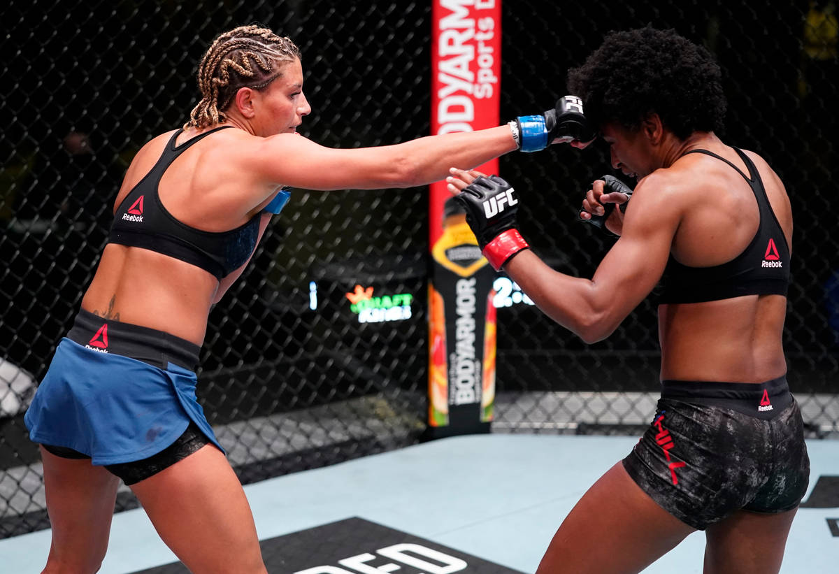 Ashley Yoder punches Angela Hill in a strawweight fight during the UFC Fight Night event at UFC ...