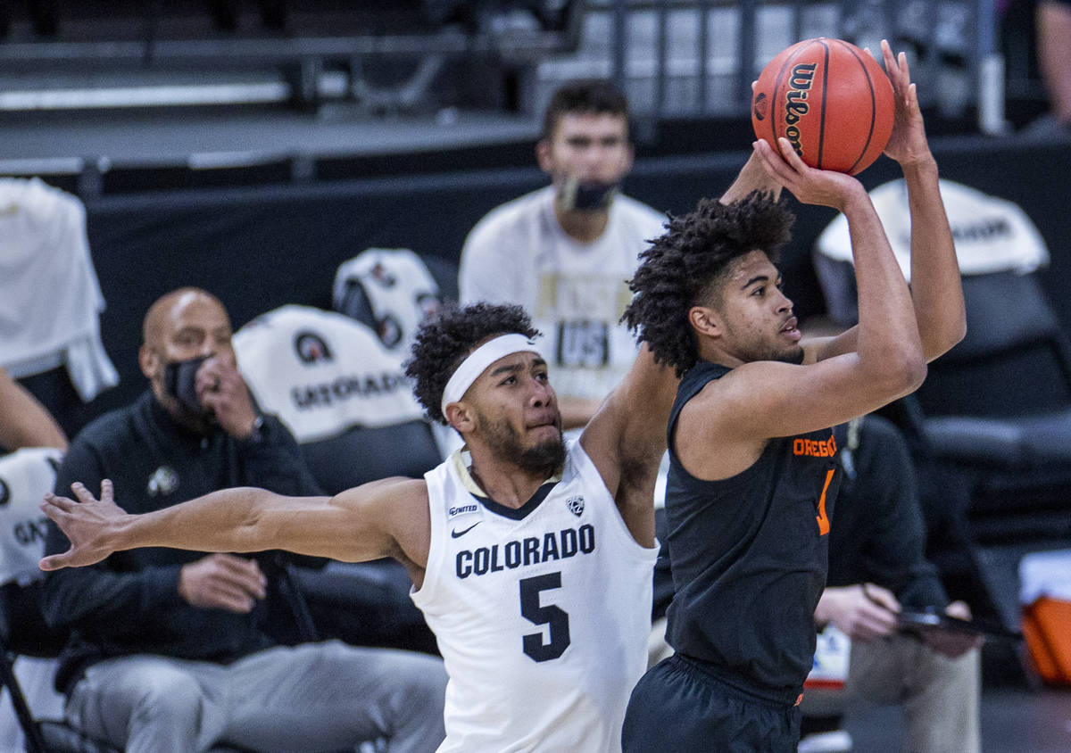 Oregon State Beavers guard Ethan Thompson (5) gets off a shot after beating Colorado Buffaloes ...