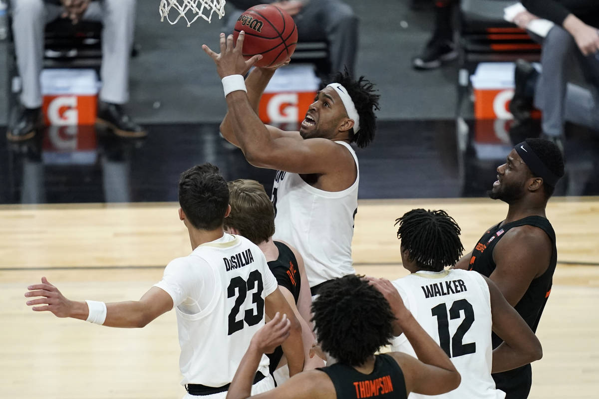 Colorado's Evan Battey (21) shoots against Oregon State during the first half of an NCAA colleg ...