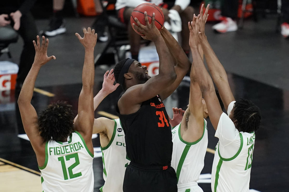Oregon State's Rodrigue Andela (34) shoots against Oregon during the second half of an NCAA col ...